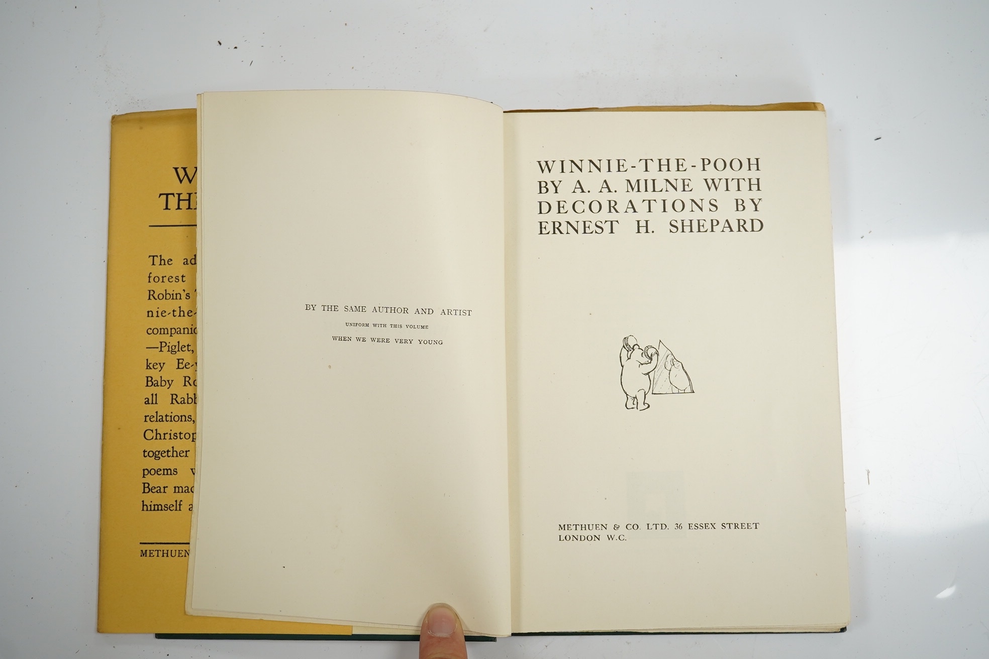 Milne, A. A. - Winnie-the-Pooh, decorations by E. H. Shepard. London: 1st edition, 1st impression, 8vo, original green pictorial cloth gilt, top edge gilt, pictorial endpapers, illustrations throughout the text, dust jac